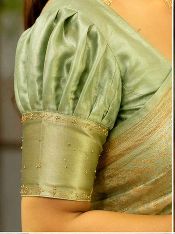 stylish blouse sleeve designs for sarees featuring puff, button, scalloped, pleated, criss-cross, bow, embroidered, and lace details.