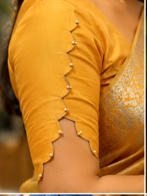 stylish blouse sleeve designs for sarees featuring puff, button, scalloped, pleated, criss-cross, bow, embroidered, and lace details.