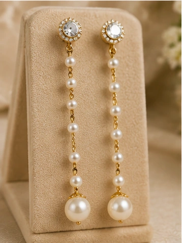 latest pearl earrings designs for women including pearl jhumkas, drop earrings, hoops and floral styles